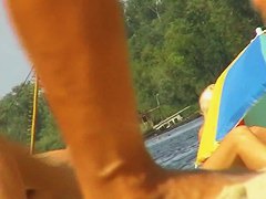 Amateur milfs on a hidden nudist beach cam