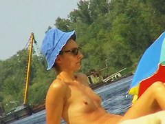 Amateur milfs on a hidden nudist beach cam