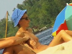 Amateur milfs on a hidden nudist beach cam