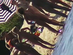 Nude beach filled with hot babes and an unsuspicious voyeur