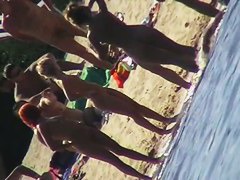 Nude beach filled with hot babes and an unsuspicious voyeur