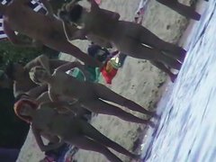 Nude beach filled with hot babes and an unsuspicious voyeur