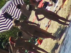 Nude beach filled with hot babes and an unsuspicious voyeur