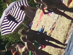 Nude beach filled with hot babes and an unsuspicious voyeur