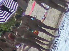 Nude beach filled with hot babes and an unsuspicious voyeur