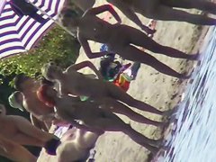 Nude beach filled with hot babes and an unsuspicious voyeur