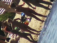 Nude beach filled with hot babes and an unsuspicious voyeur
