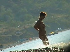 Several sexy nude girls caught on a beach with a spy cam