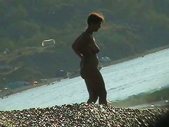Several sexy nude girls caught on a beach with a spy cam