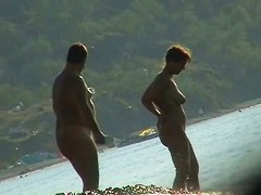 Several sexy nude girls caught on a beach with a spy cam