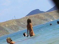Free nudist beach avi of a crowd of naked people
