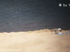 Perky breasted babe flaunts her muff on a nudist beach