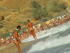 Lush bodied MILF parades before a nude beach voyeur