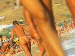Lush bodied MILF parades before a nude beach voyeur