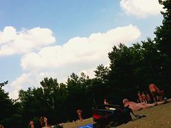 Naked valley at the nudist beach with girls and audlts