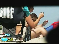 Beach nudist voyeur video of a milf with huge tits flashing it all in public