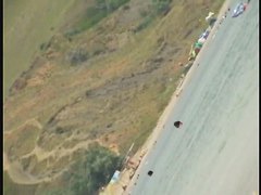 Nudist girls splashing around and playing in shallow water
