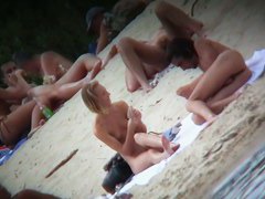 Tiny boobs exposed on the beach for hidden cam voyeur video