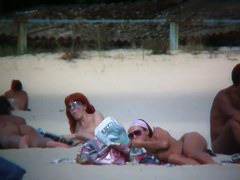 Perky breasted sweetie with a full bush followed on a nudist beach