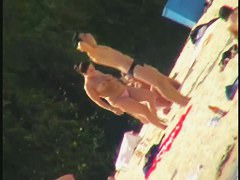 Naked bimbos at the beach on beach voyeur spy cam video
