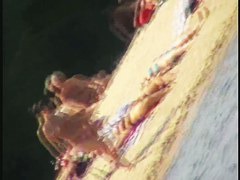 Naked bimbos at the beach on beach voyeur spy cam video