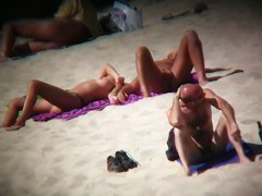 Hot ladies with cool butts and small boobs relaxing on the beach