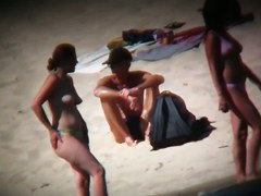 Hot ladies with cool butts and small boobs relaxing on the beach