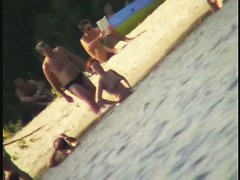 A horny voyeur loves filming hot nudity on the beach.