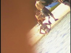 A horny voyeur loves filming hot nudity on the beach.