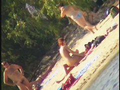 A horny voyeur loves filming hot nudity on the beach.
