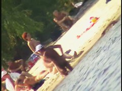 A horny voyeur loves filming hot nudity on the beach.