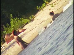 A horny voyeur loves filming hot nudity on the beach.