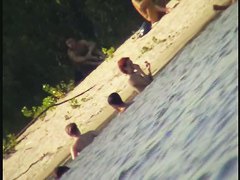 A horny voyeur loves filming hot nudity on the beach.