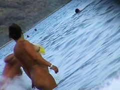 Fat ass big boobed woman is swimming at the summer beach