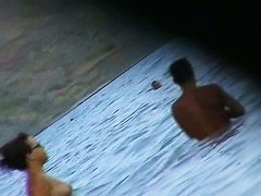 Fat ass big boobed woman is swimming at the summer beach