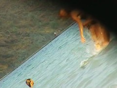 Fat ass big boobed woman is swimming at the summer beach