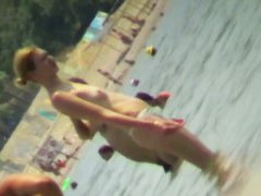Beach voyeur hunting attractive nudist cooling in the sea