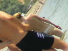 Beach voyeur hunting attractive nudist cooling in the sea