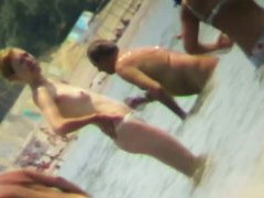 Beach voyeur hunting attractive nudist cooling in the sea