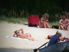 Busty blonde nude beach MILF spied on by a voyeur