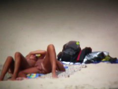 Busty blonde nude beach MILF spied on by a voyeur