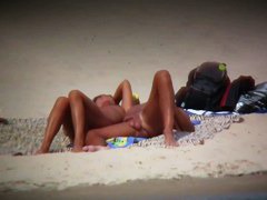 Busty blonde nude beach MILF spied on by a voyeur