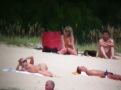 Busty blonde nude beach MILF spied on by a voyeur