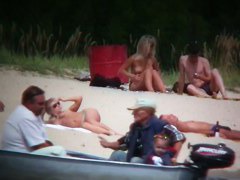 Busty blonde nude beach MILF spied on by a voyeur