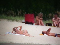 Busty blonde nude beach MILF spied on by a voyeur