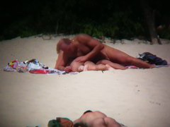 Hot couple caught on a nude beach spy cam vid