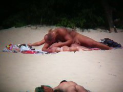 Hot couple caught on a nude beach spy cam vid