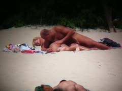 Hot couple caught on a nude beach spy cam vid
