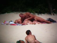 Hot couple caught on a nude beach spy cam vid