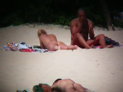 Hot couple caught on a nude beach spy cam vid